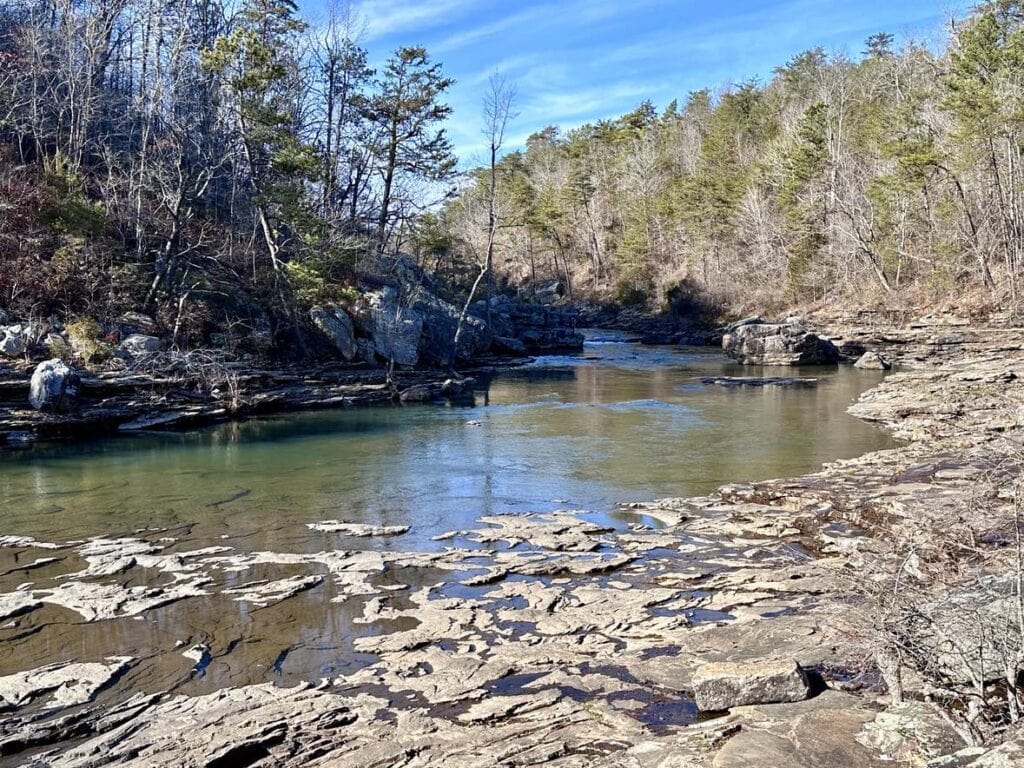 Little River Canyon: A Budget-Friendly Family Adventure Scenic view of Little River winding through the picturesque landscape of Little River Canyon, Alabama.
