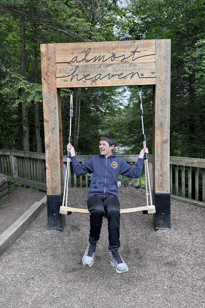 Blackwater Falls State Park Guide: Trails & Top Sights Kid swinging on the almost heaven swing at Blackwater Falls
