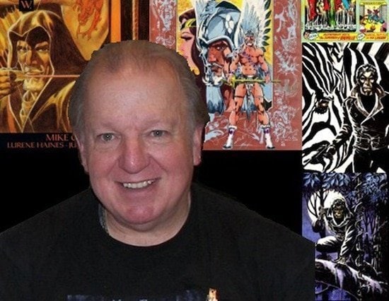 Comic artist at Hero Initiative event, surrounded by colorful comic book art.