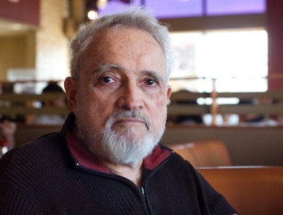 Senior man with gray hair and beard at Hero Initiative event.