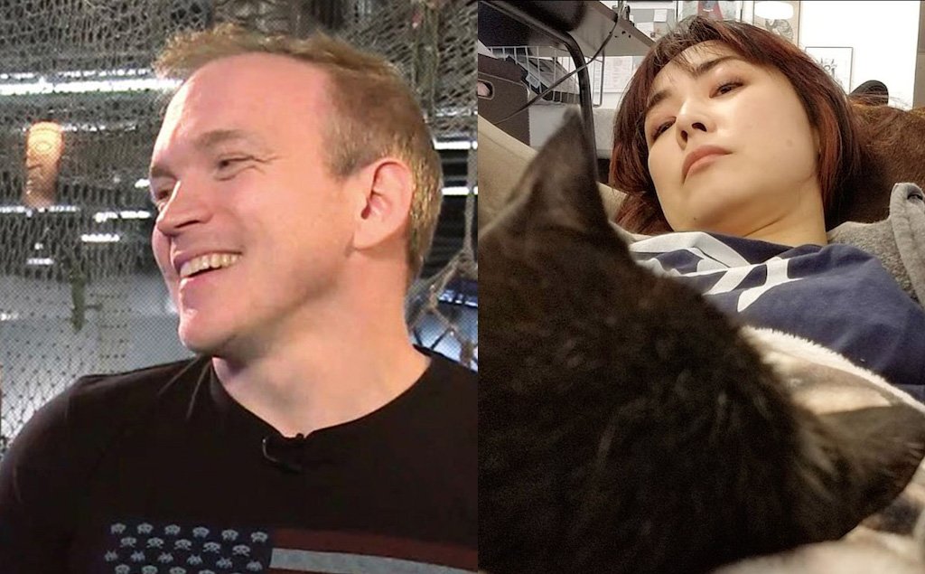 Two people with a cat, one smiling and one resting, at Hero Initiative event.
