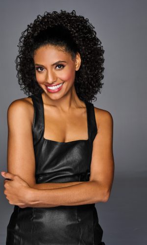 Coily Cinched Ponytail with Voluminous Curls.