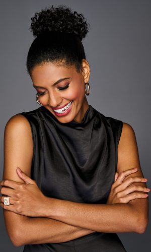 Elegant coily wrap wig showcasing natural textured curls. Perfect for a stylish, protective hairstyl.