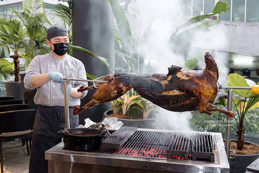 Live station buffet by iDoCatering, featuring chefs carving lamb on the spot