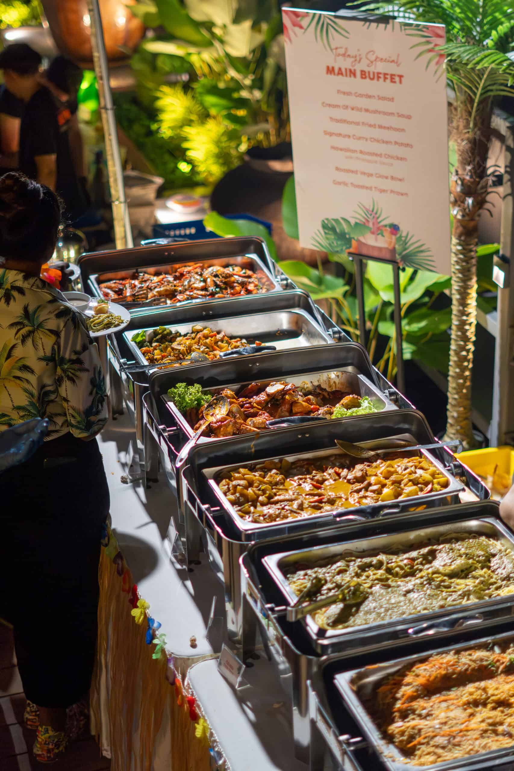 Buffet catering services by iDoCatering with a wide selection of dishes and a beautifully arranged buffet table"
