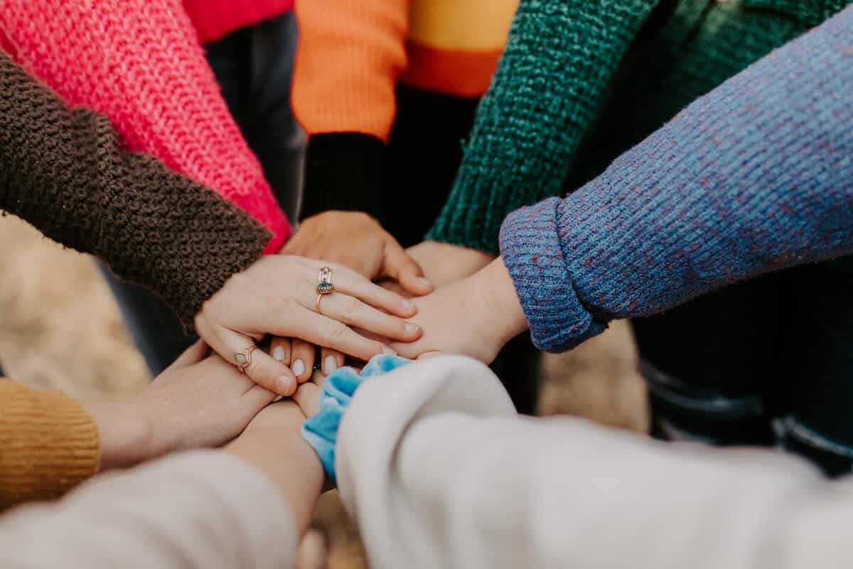 Women joining hands in a circle