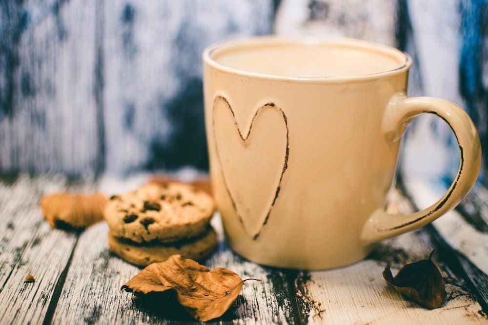 a coffee cup with cookies