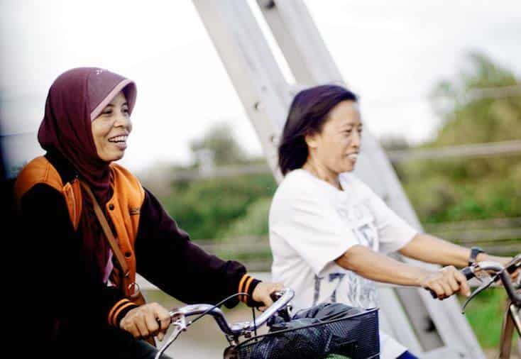 Two women on bikes