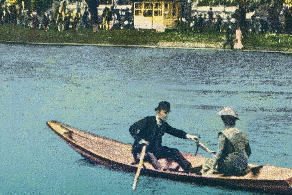 A man and a woman in a boat on a lake