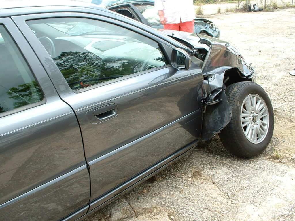 damage to right front passenger side of car