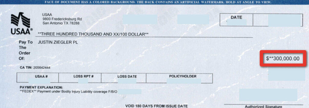 An image of a $300,000 settlement check related to a motorcycle accident case handled by JZ helps