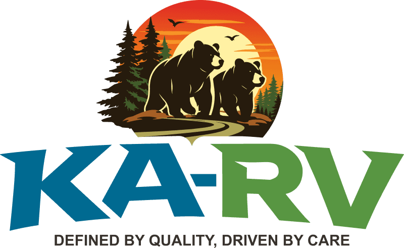 Image showing a bear and cub silhouette at sunset with trees in the background.