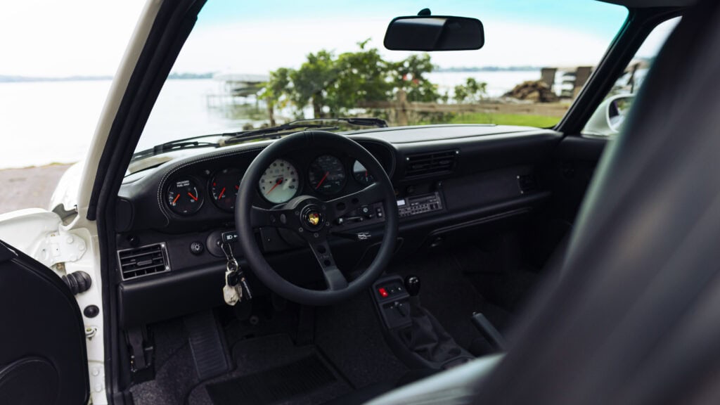 View of the dashboard and steering wheel of a 1993 Porsche 964.
