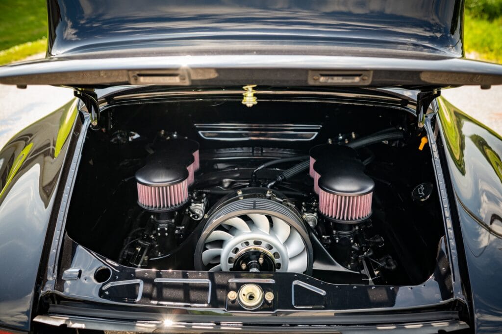 Close-up of the engine bay of a 1989 Porsche 964 sports car.