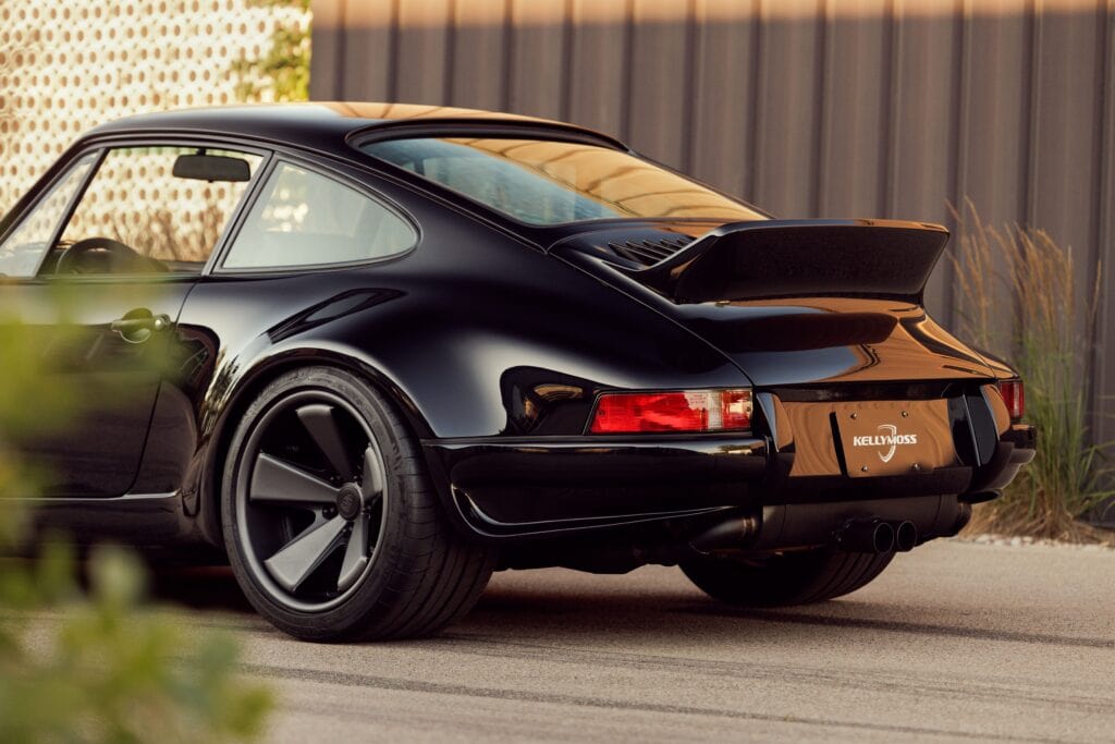 Black 1989 Porsche 964 with sleek design and aerodynamic features.