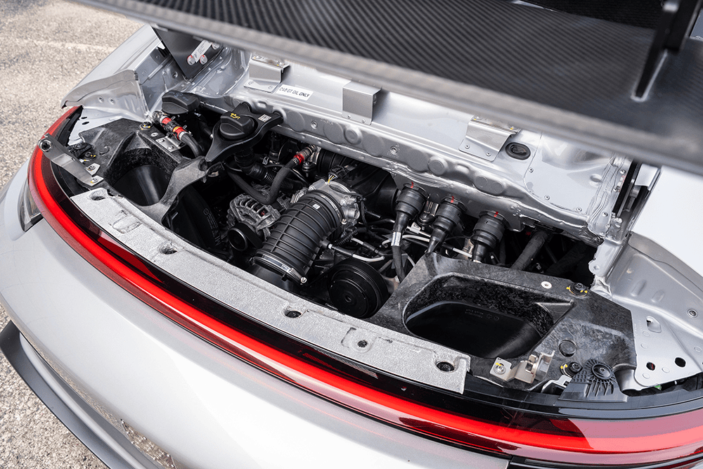 Close-up of Porsche 911 GT3 Cup 992 engine in rear compartment.