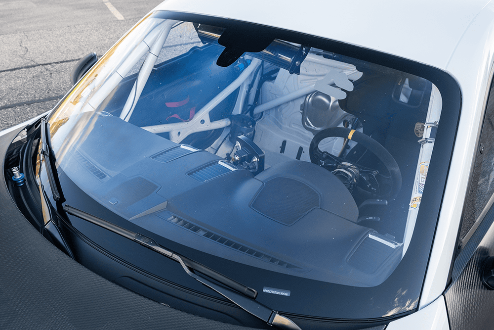 Close-up of Porsche 981 Clubsport MR engine through windshield.