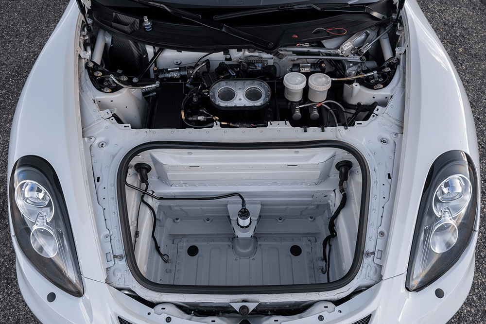 Front trunk of a 2016 Porsche 981 Clubsport MR with engine components visible.