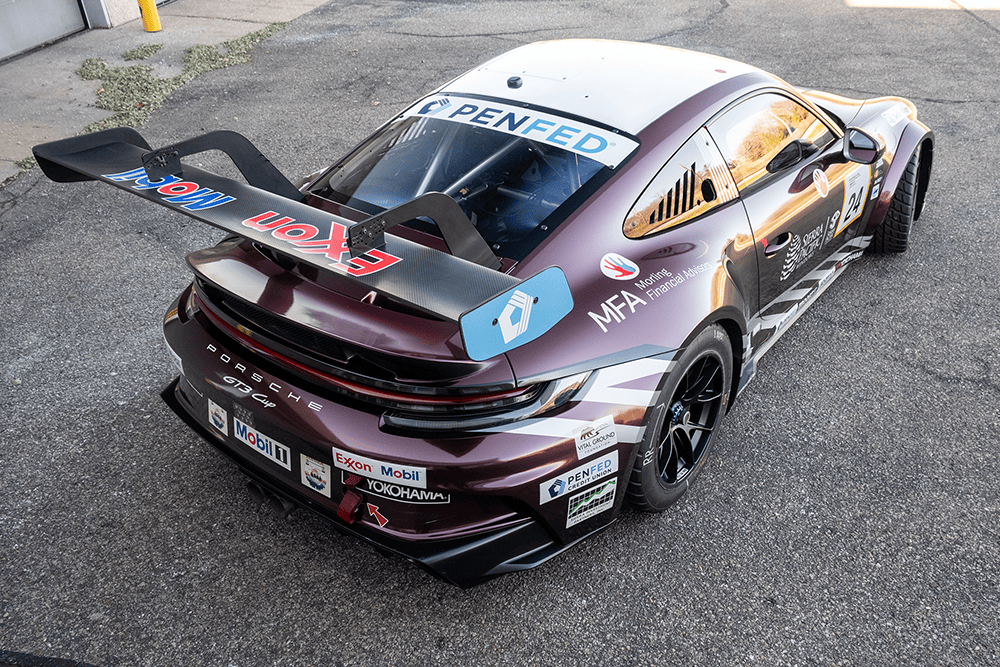 2024 Porsche 911 GT3 Cup 992 race car with sponsor decals and aerodynamic features.
