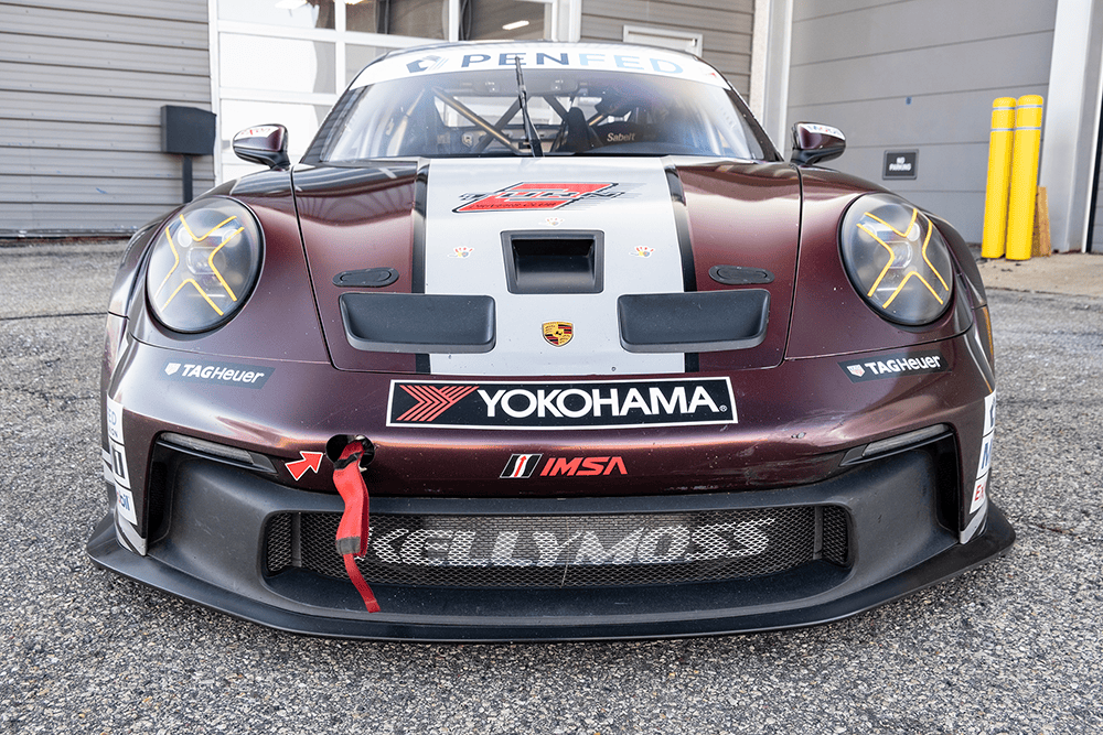 Kellymoss Porsche 911 GT3 Cup race car front view with sponsor decals.