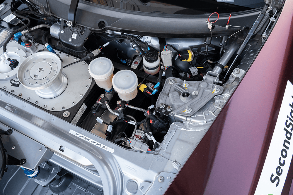 Close-up of the Porsche 911 GT3 Cup 992 engine components and cooling system.