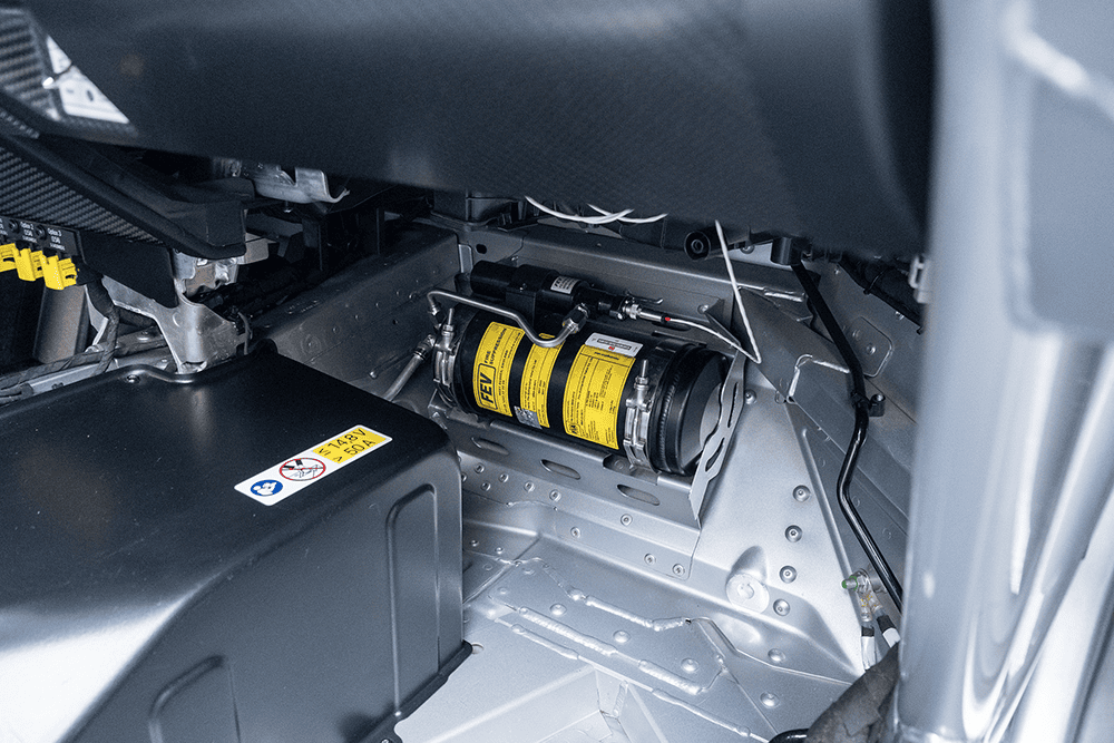 Close-up of engine compartment in Porsche 911 GT3 Cup 992 race car.