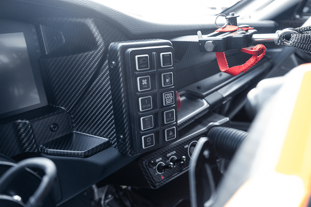 Close-up of interior controls in a Porsche 911 GT3 Cup 992 race car.