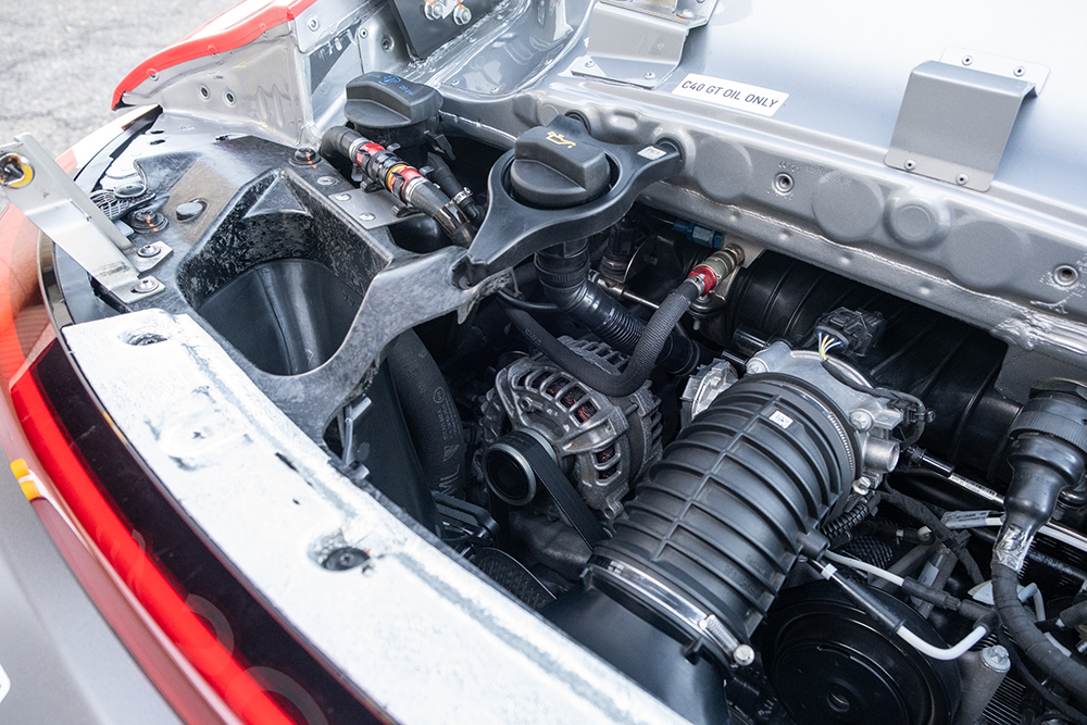 Close-up of the Porsche 911 GT3 Cup 992 engine and components.