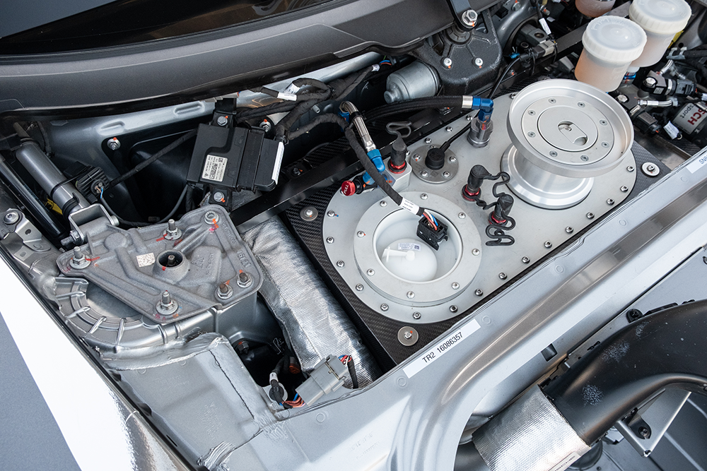 Close-up of the Porsche 911 GT3 Cup 992 engine components and cooling system.
