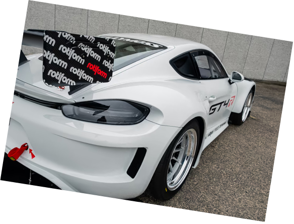 White Kellymoss GT4R race car with racing decals and aerodynamic features.