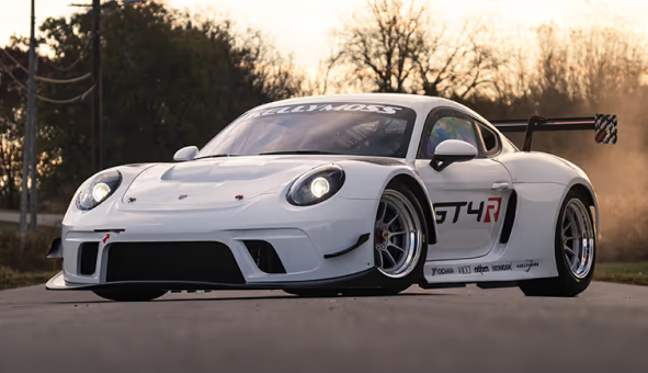 Kellymoss GT4R race car on track with sunset background.