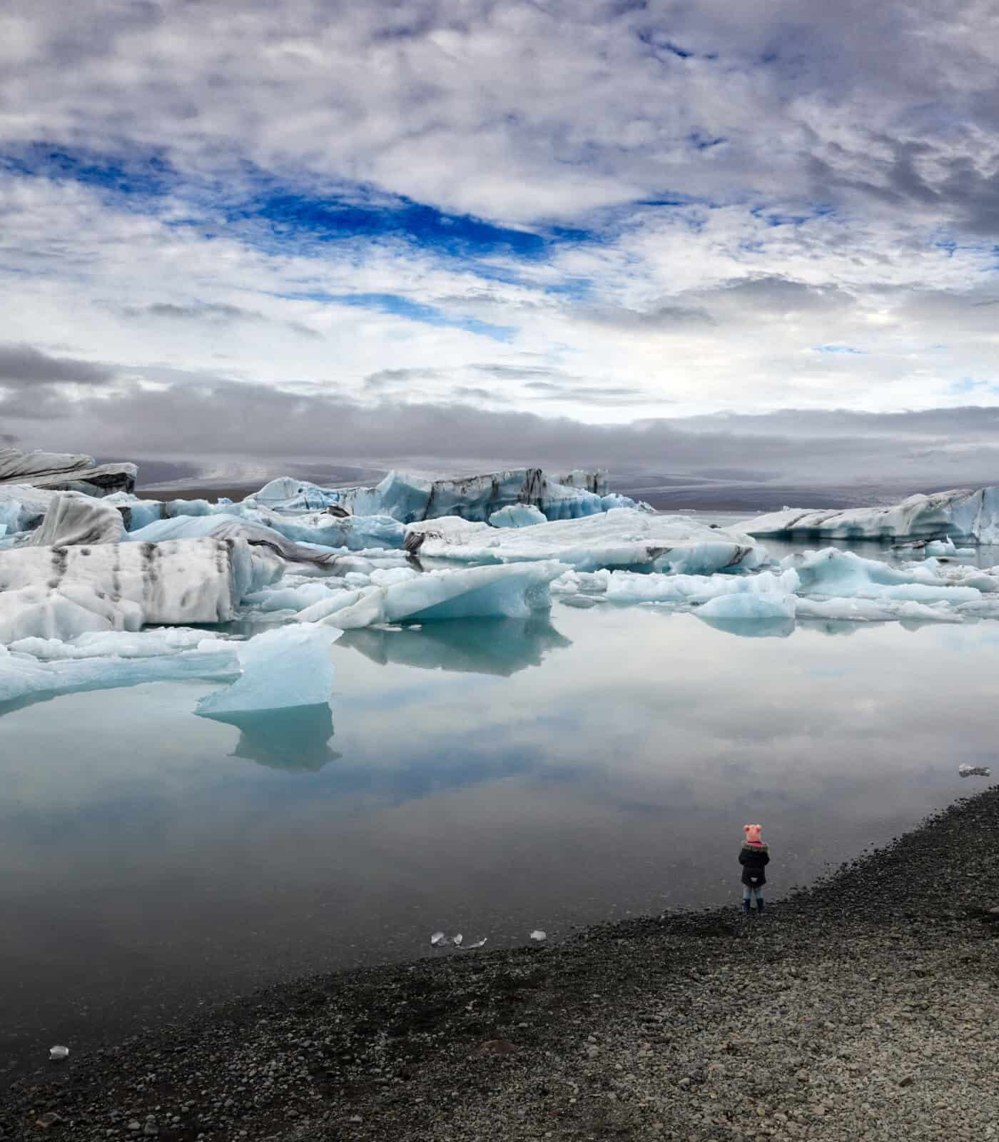 little girl standing on Diamond beach in Iceland