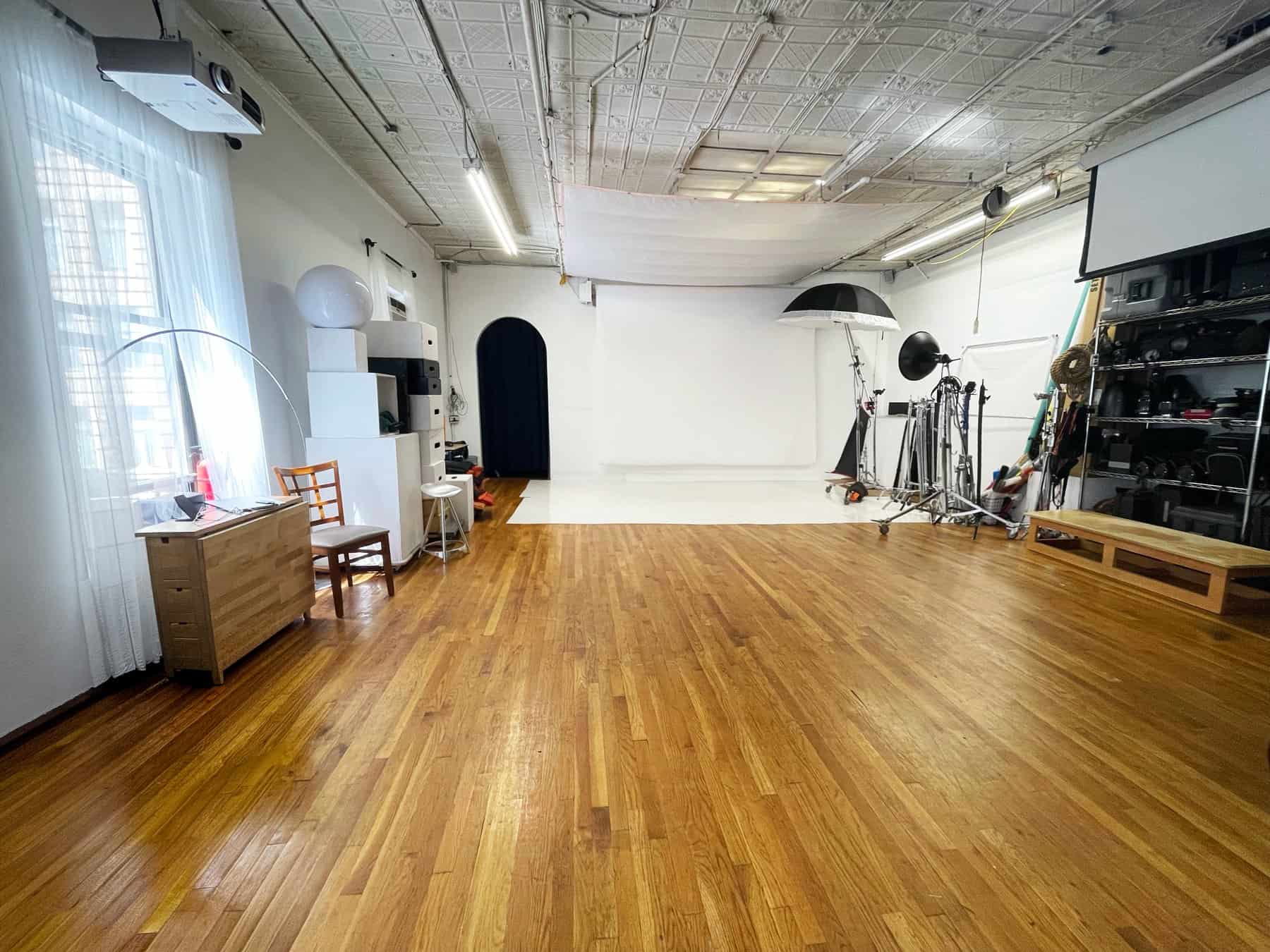 Open Manhattan photo studio rental space with hardwood floors and large shooting area