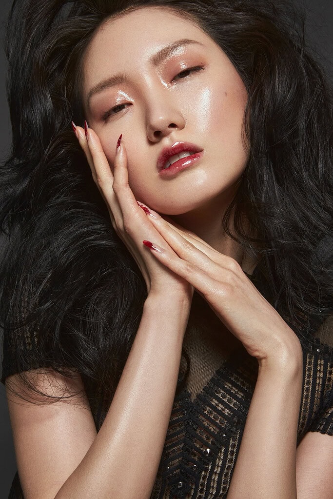 Close-up portrait of a woman with long black hair and flawless makeup. photographer NYC