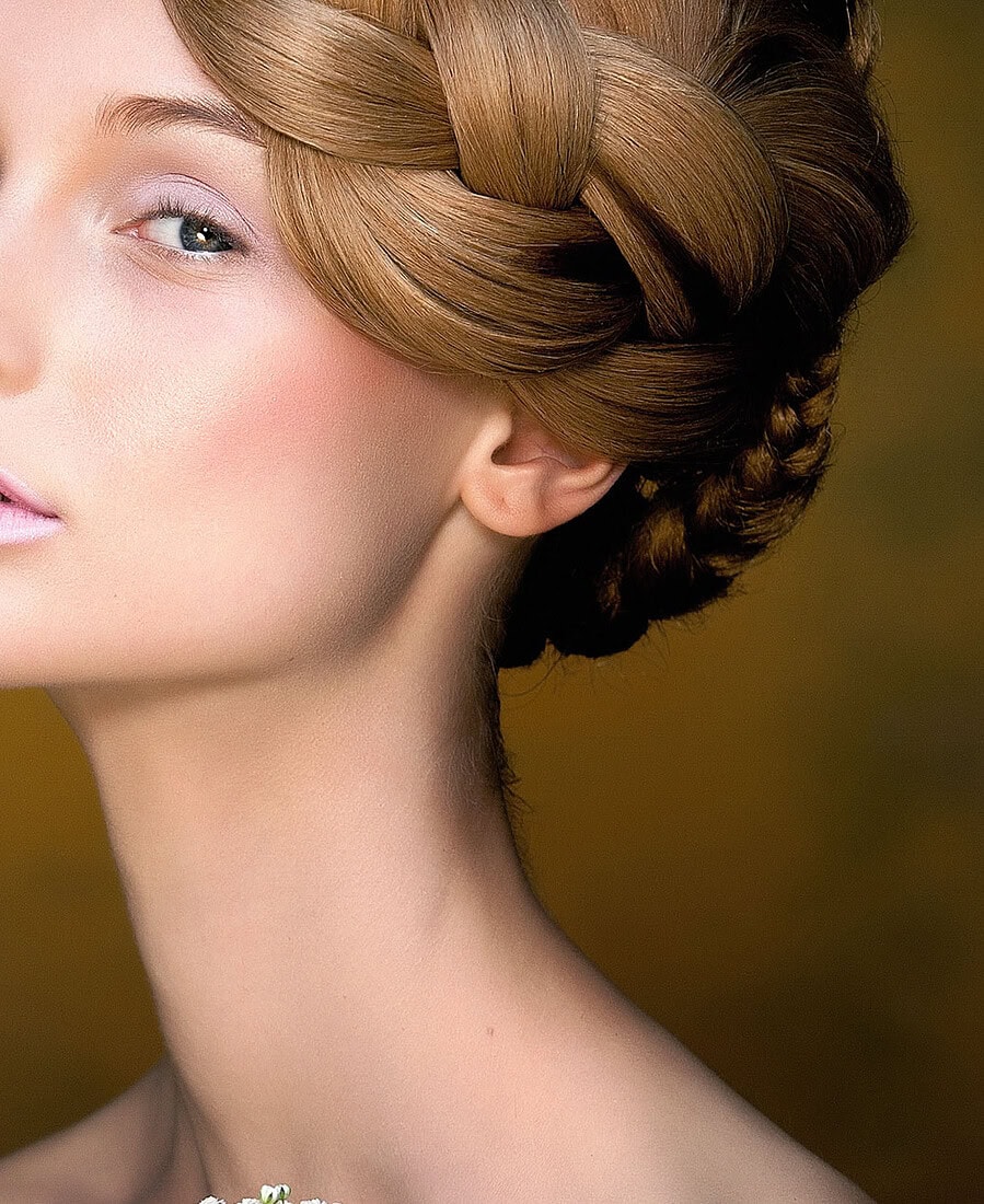 Beauty image of a European woman with an orchid in her hair