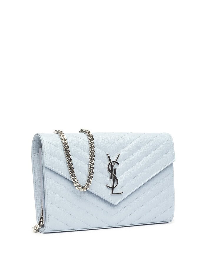 Light blue quilted Saint Laurent chain wallet with silver YSL hardware on white.