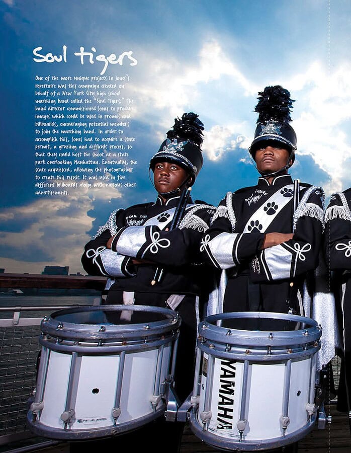 Four Soul Tigers marching band drummers posed with instruments against a dramatic city skyline.