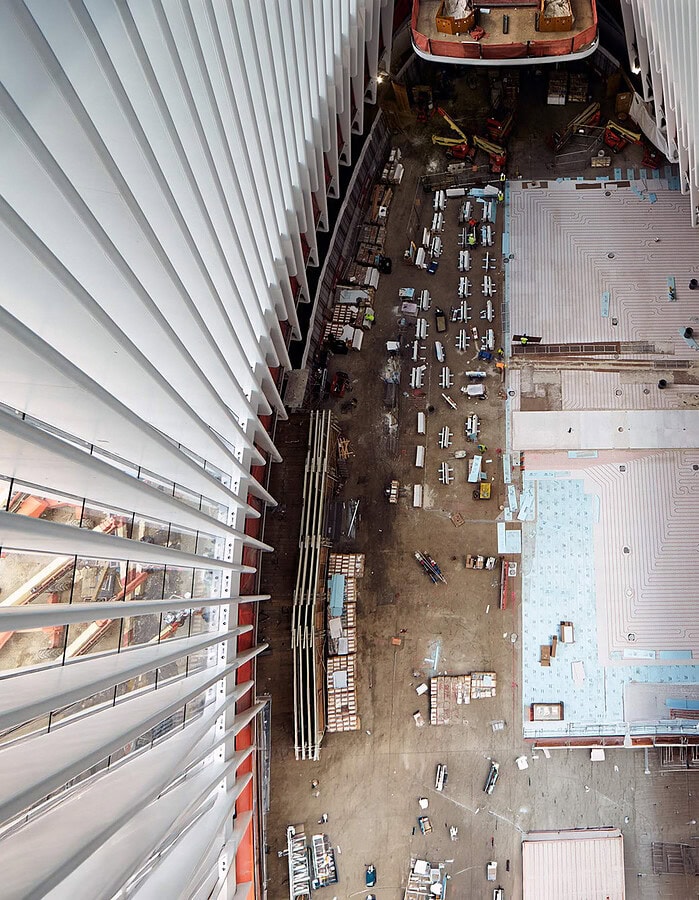 Overhead view down between the white ribs of the World Trade Center Oculus during construction.