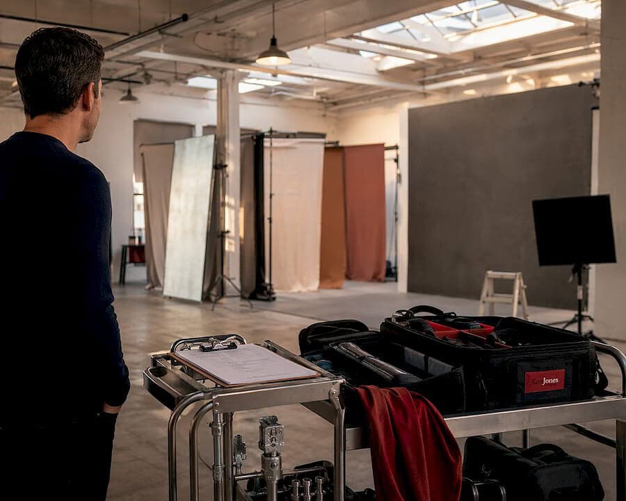 Photographer inspecting rented NYC studio space with production gear