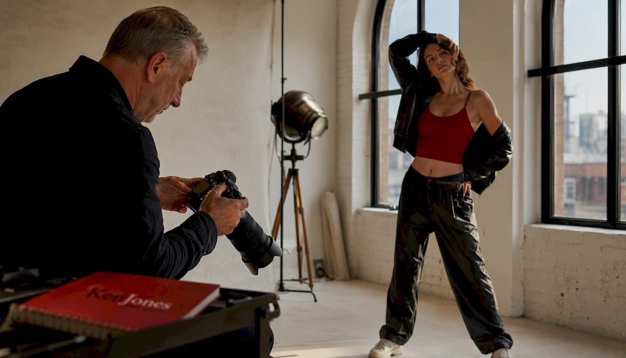 Photographer adjusting lights during composite studio shoot