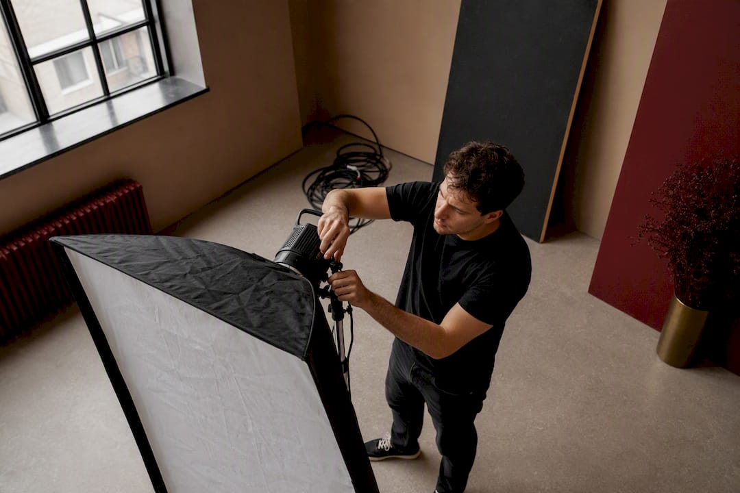 Lighting technician adjusting softbox light
