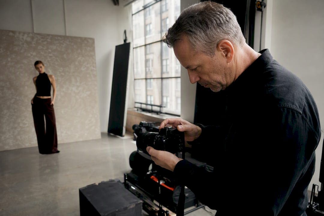 Photographer reshooting images in studio
