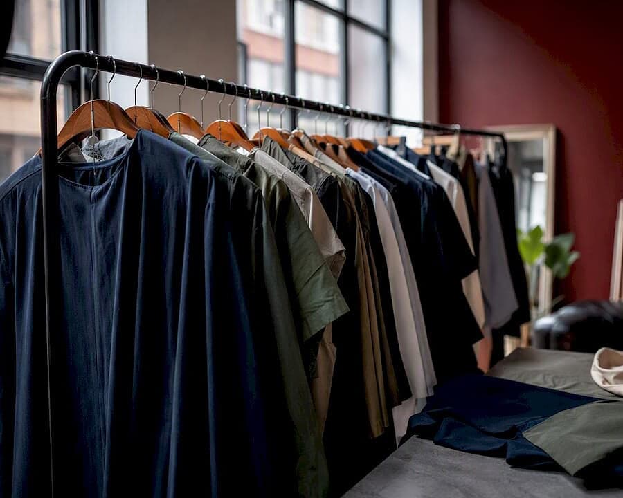 Studio rack with mid-tone interview wardrobe fabrics