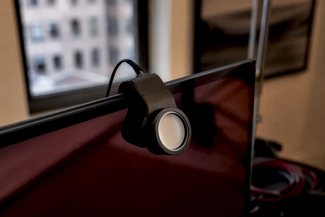 Monitor calibration tool attached to monitor
