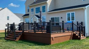Large wooden deck with stairs and railings