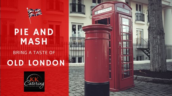 Traditional London pie and mash meal served in a classic red telephone box setting.