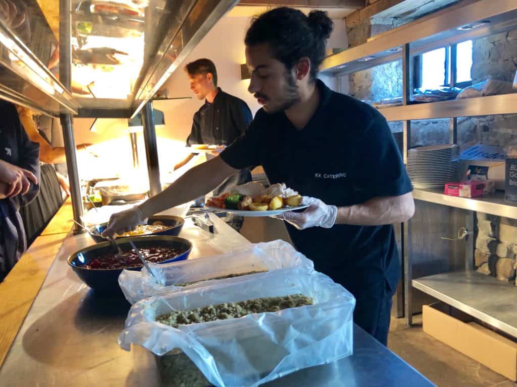 Guests enjoying interactive carvery catering with roast meats and sides in the UK
