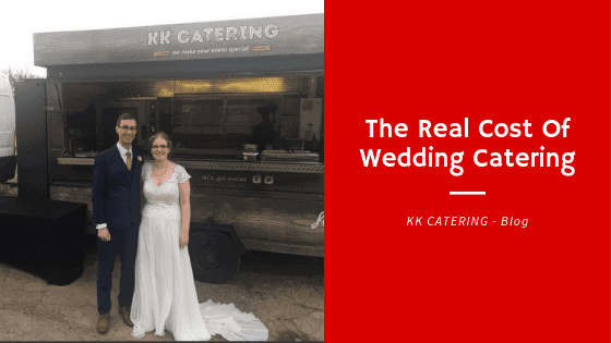 Couple standing in front of pizza van