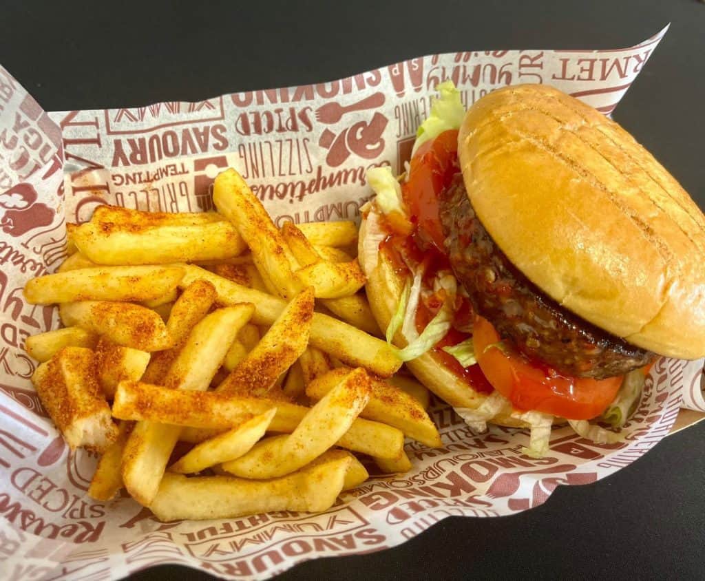 Fresh burger with fries served at KK Catering in the UK, perfect for catering and food delivery services.