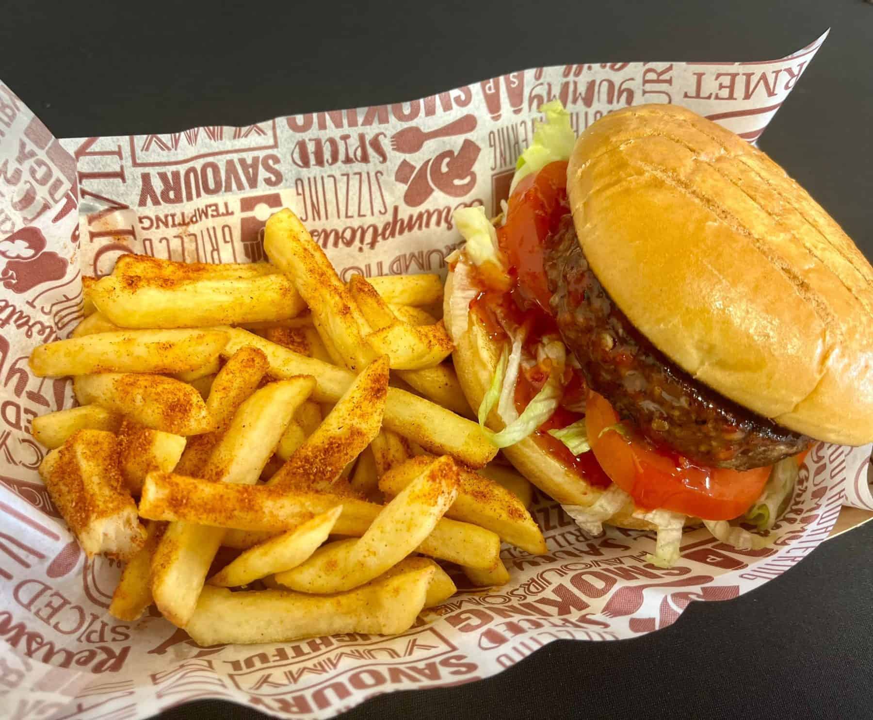 Fresh burger with fries served at KK Catering in the UK, perfect for catering and food delivery services.